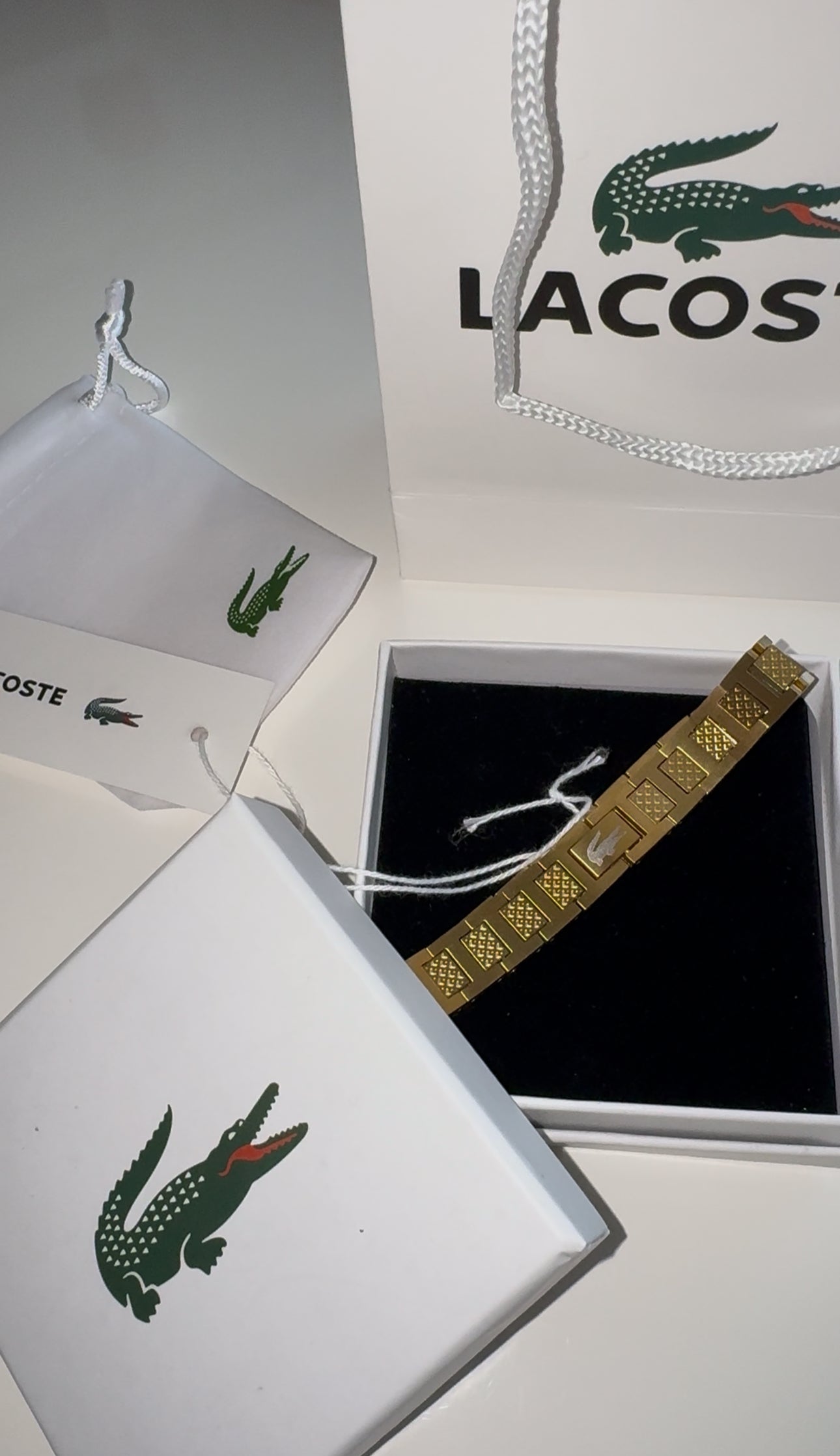 Lacoste bracelet with bag and box gold